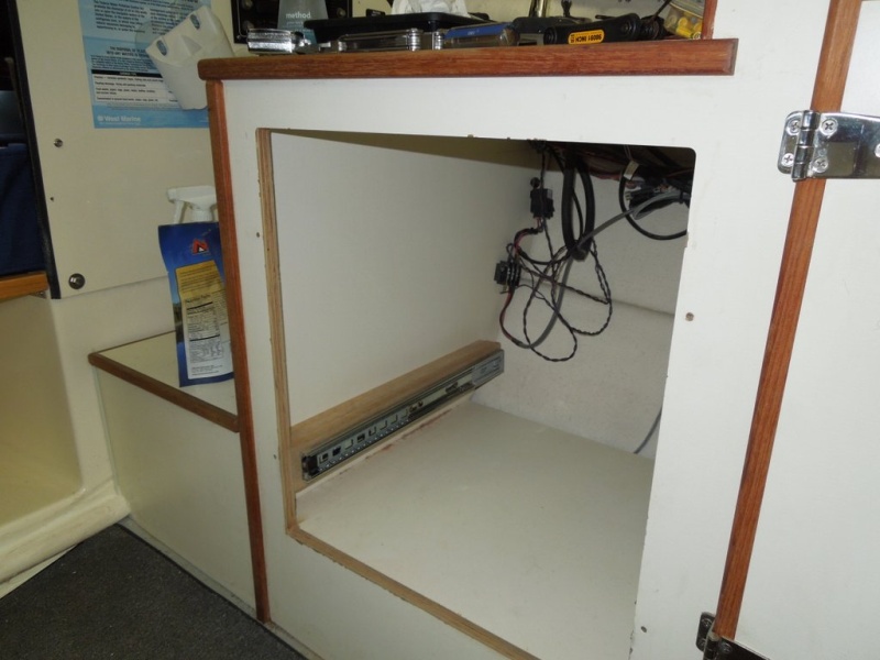 Area under helm seat where refrigerator was located.