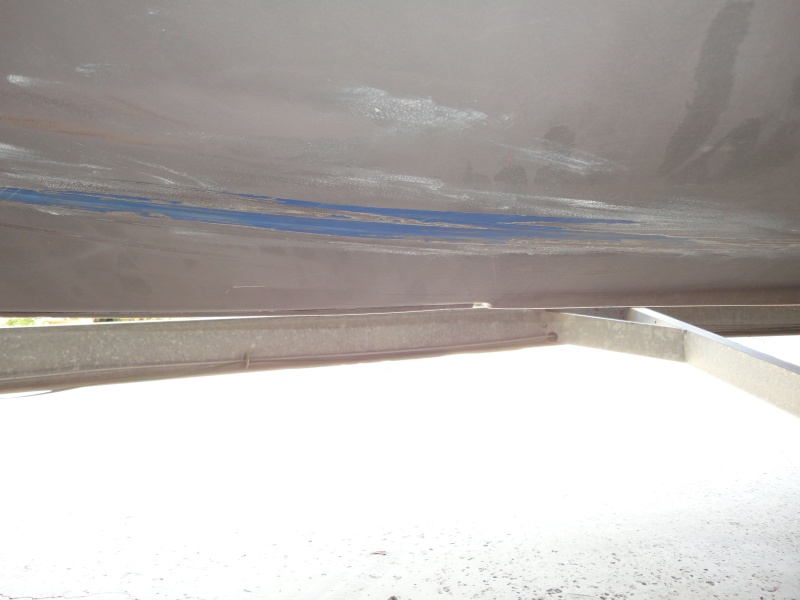 area where bottom paint worn off by trailer bunk loading