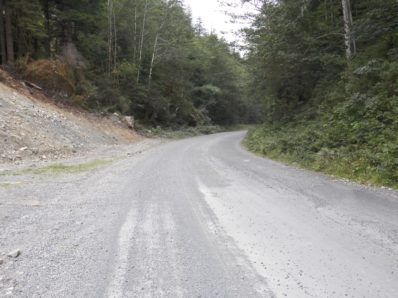 At the edge of town, it's 45km of gravel logging road out to pavement.  Speed limit is 60km.  80km for log trucks.
