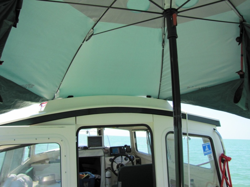 Attach with ball end bungee to hand rail.