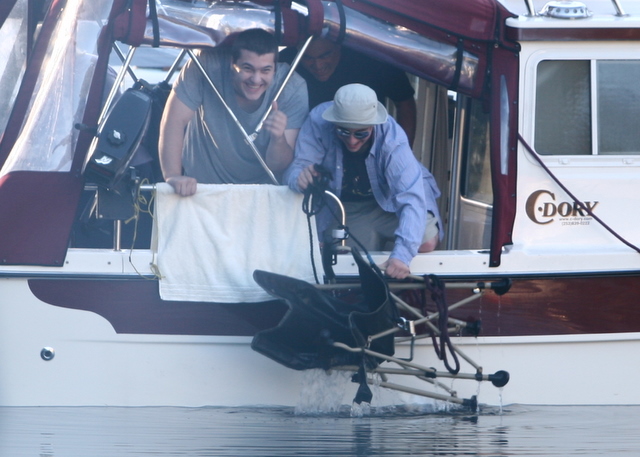 Austin and Jared triumphantly retrieve a chair from the briny deep. How did it get there? That must forever remain a secret of Pirates' Cove . . .