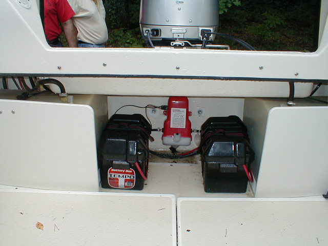 Batteries mounted next to gas tanks, freeing up lazarettes.