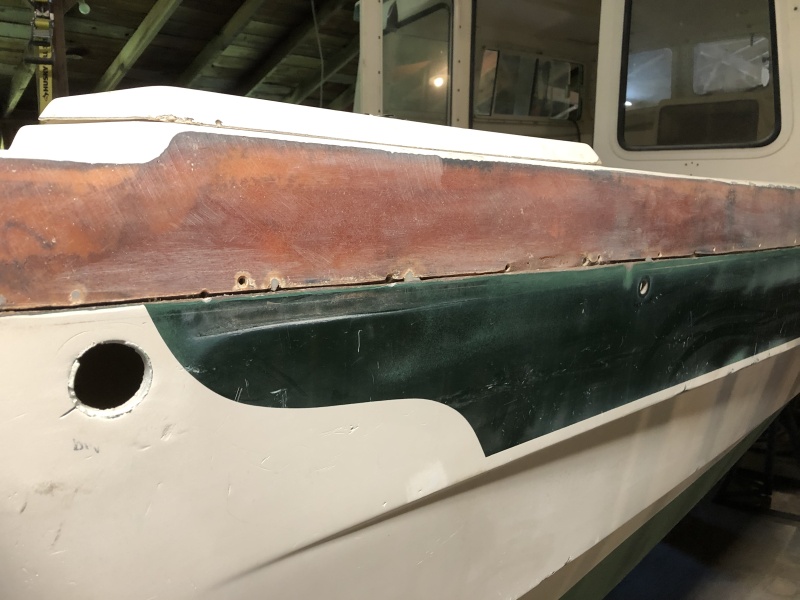 Because the section of the boat above the rubrail had many areas of spider cracking, I just removed all the gelcoat from that part of the boat. In some spots the spider cracking continued into the fiberglass so I removed that as well, and then put new fiberglass over the entire area. I used polyester laminating resin to do all gelcoat repair, which required painting with gelcoat so it would cure. Then sanding off the gelcoat so a final layer of Totalboat epoxy fairing can be applied and sanded down smooth in prepartion for the Alexseal primer coat.
