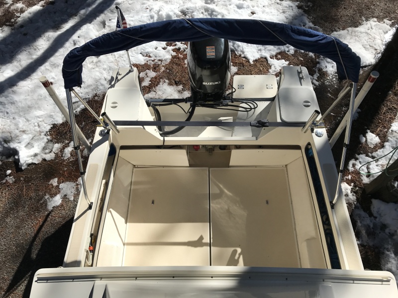 Bimini top also includes three piece camper back with clear vinyl windows and screens.