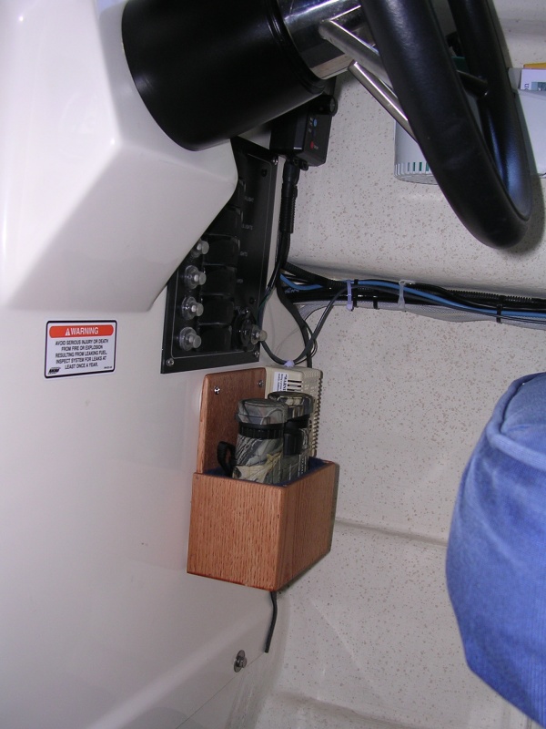 Bino rack.  1/4\" oak lined with felt.  Located below circuit breaker panel at helm station.