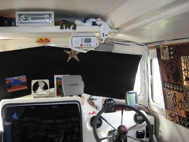 Blackout curtains and dash layout.   You can just make out "Gord" our guide frog on the electronics shelf. One needs a pet and he works cheap. Also my micronesian star chart from my buddy Winston for good navigation luck