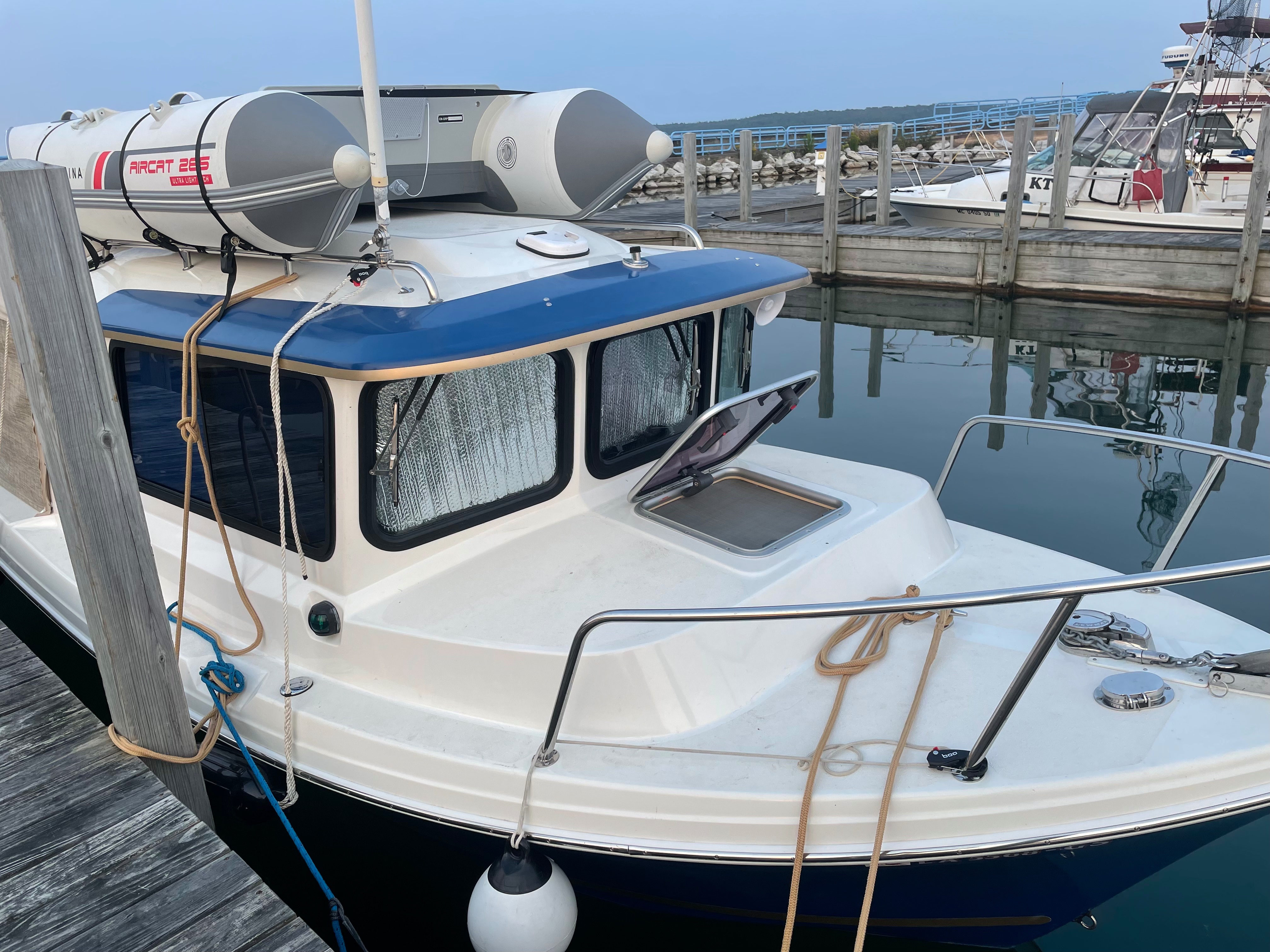Blackout Shades fitted fore & aft… roll down sides blue exterior silver interior