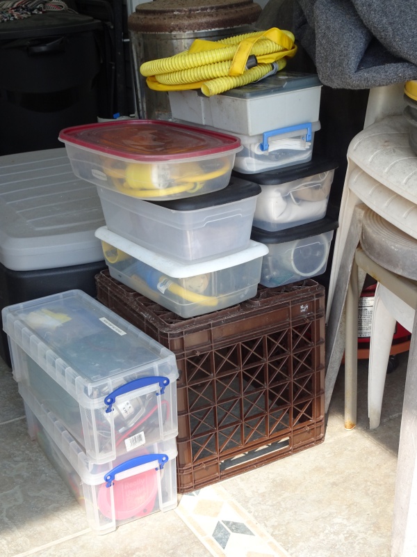 boxes which are kept under the cockpit and under the slash well.  These contain electrical adaptors, pump for the inflatable boat, spare engine parts, and shade cloths for the cockpit (keeps the sun out, yet allow ventilation.