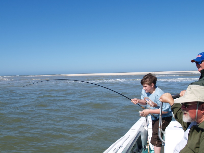 Brad, Guide Charles' grandson, hooks up with his first redfish!