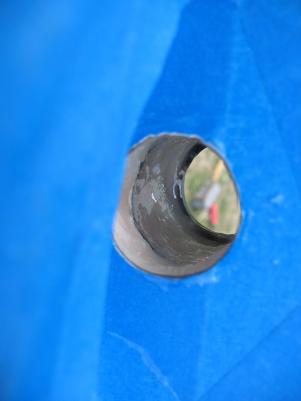 Bringing the fill up to the proper thickness.  After this I overfilled it a bit, and then "buttered" the tube so that it would "squooge" into place with plenty of epoxy all around.