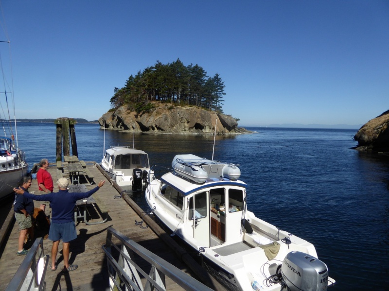 Brock describing "the one that got away" to a couple of sailors at Matia