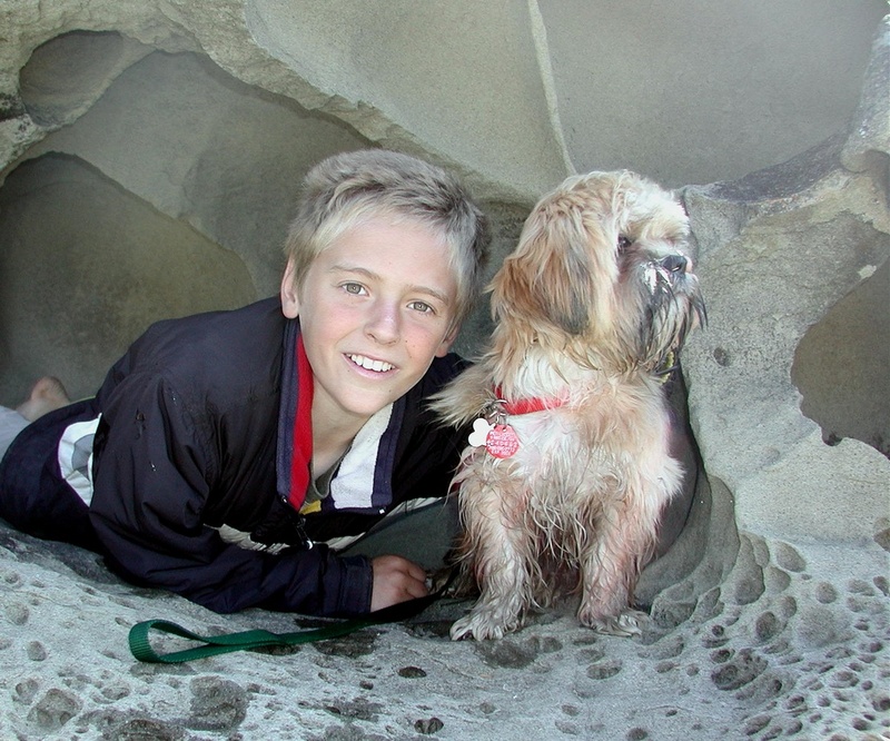 Bryce and Oscar in a Sandstone Cave Galiano Island 6-25-04