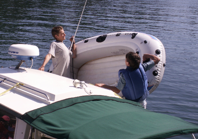 Bryce and Tye Hoist the Dinghy at Doe Island 6-27-09