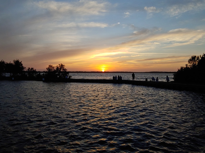 Bunches of folks showing up to watch the sun go down at Carolina Beach State Park.
