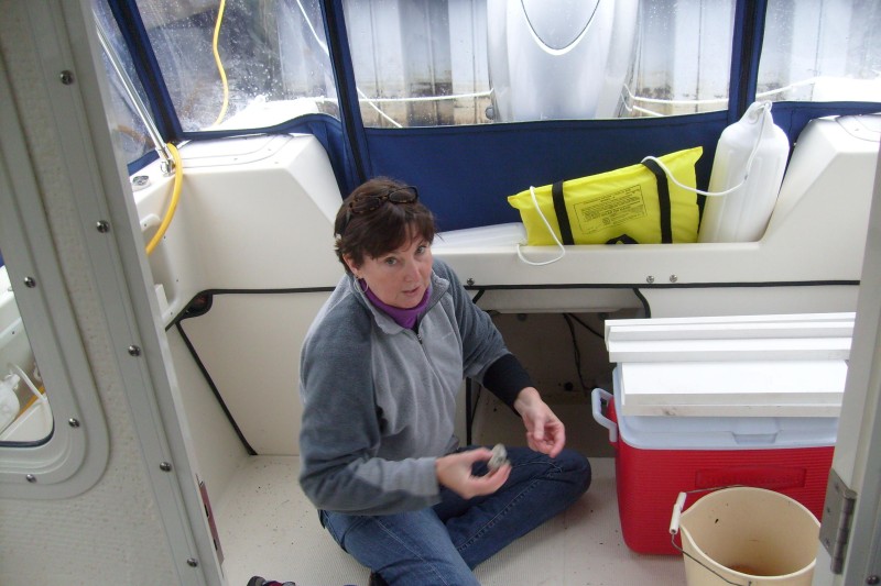 Captain clearing the bilge of water in anticipation of sub-freezing temperatures - (3JAN10)
