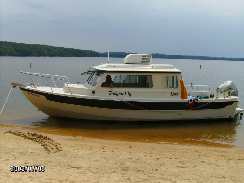 Captain Larry on the Dragonfly beached at Jordan Lake, NC