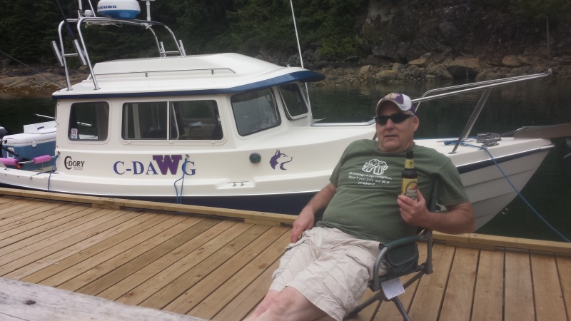 Captain Rick in front of his prized possesion, C-Dawg, a great fishing machine.