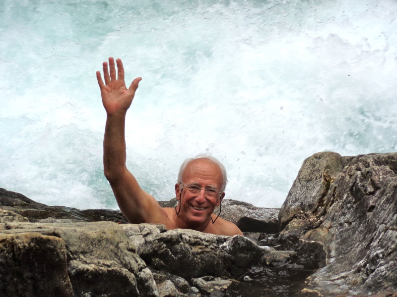 Casey in a warm spring "hole" at Baranof Warm Springs with the raging falls a foot or two away.