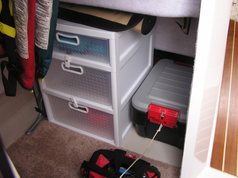 "Cave": removed cushions, added storage drawers with keep-closers, containers for tools and repair supplies