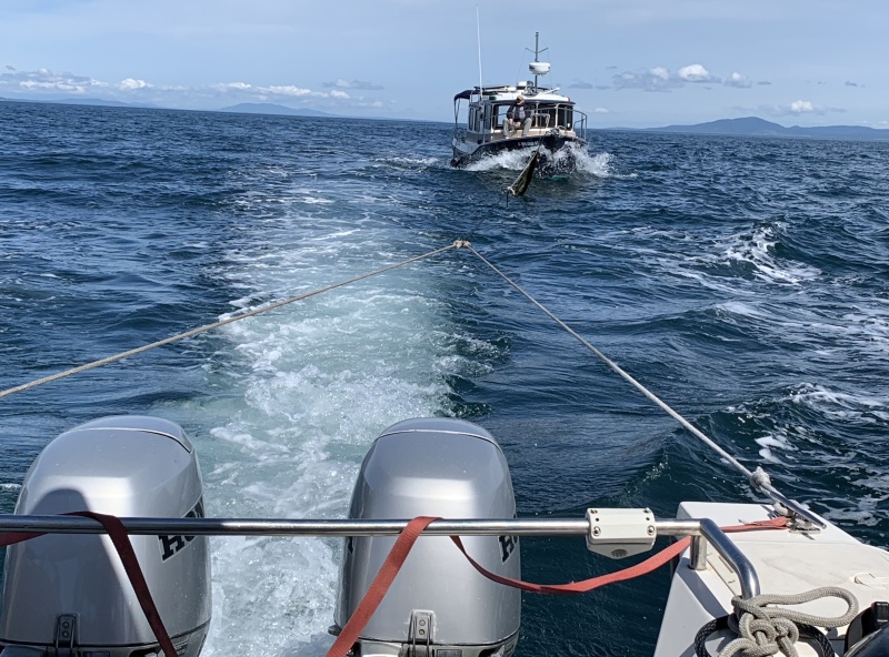CD 22 Hunkydory towing Ranger Tug 25 across Strait of Juan De Fuca to Sequim