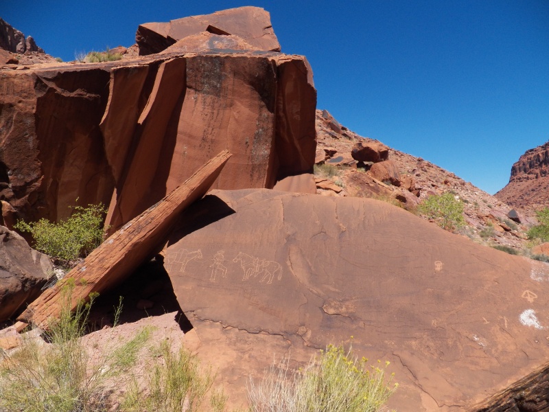 Cha canyon has some petroglyphs, but many have been vandalized like this.  Maybe they couldn't see that they were defacing older petroglyphs?