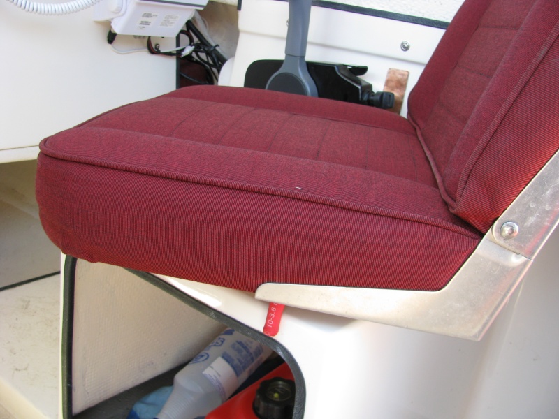 Chair Stop -- In action. The rubber coated stop prevents the chair from turning excessively, stopping the back of the seat from damaging the engine throttle assembly.