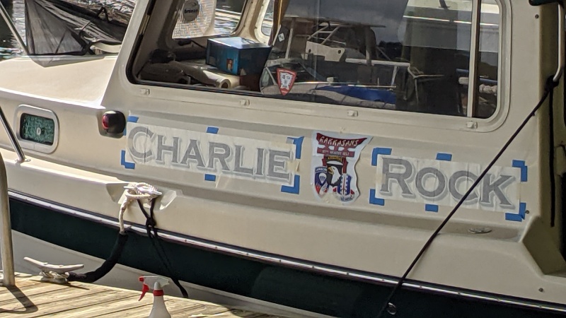 Charlie Rock gets her name.  it's all in the prep!  I had never used the "wet install" method for boat or truck decals.   What a breeze.  Not a single bubble, even where they had been shipped, or stored with wrinkles.  The bigger the squeegee the better.  And painters tape for location marking.  2 hours of prep ( port and starboard name rapes, 187th aarct decals on both side and cabin door, port of call on stern, and registration on both sides of bow).  An hour to dry, and 45 mins of tape and backing removal.