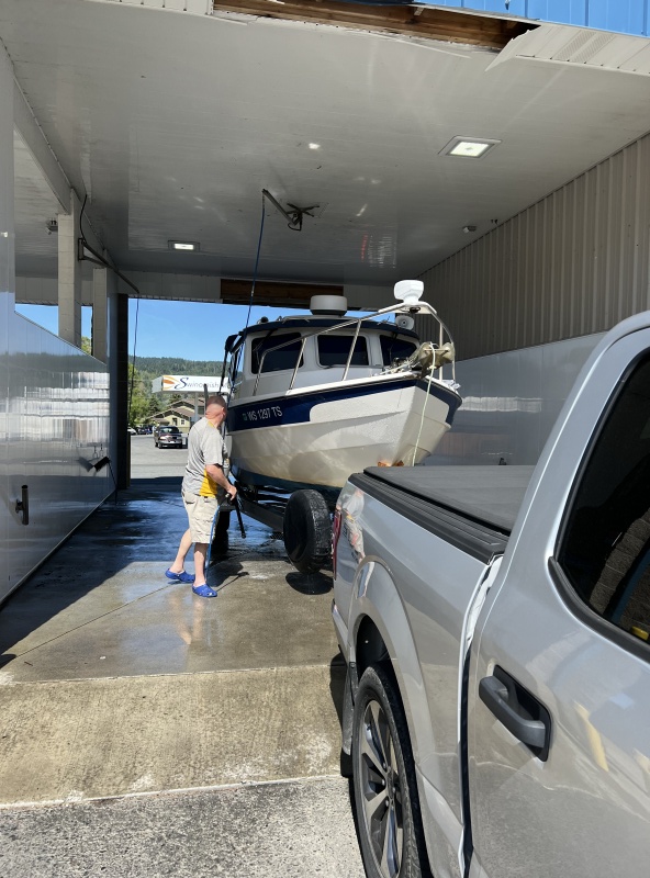 Cleaning the scum off C-Traveler after slinging out at Cap Sante