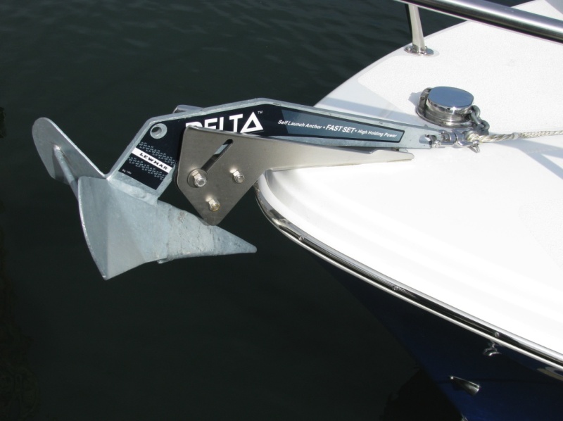 Close up of 14# Delta anchor. It has 25' 1/4" HT chain and 200' of 1/2" Anchor line.  On June 14-15, we used this arrangement for the first time.  It sets easily by hand, and it releases easy by hand.  It held fast in the 10-foot muddy river bottom, with winds around 5 knots, and large power cruisers passing by.  This confirms that did not need a windlass for new England, where the waters are shallow (as opposed to the PNW, where a windlass is desireable.) REVISION:  We no longer use the 14 pound anchor, because it does not hold in silt.  We now use a 22 pound Lewmar Delta, which I think would benefit greatly from a windlass.