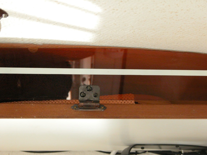 Close up view of hinge and its brass hardware.