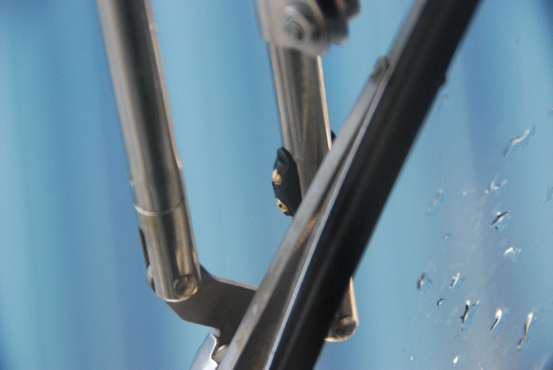 Close up view of the replacement AFI \"wet\" Pantographic arm spray head. There are two adjustable nozzels on each side of the arm that cover large areas of the window.