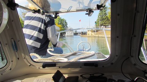 Coming up on a lock. These locks are mostly tended by girls who crank the lock doors open and closed by hand. They also manually open and close the water gates to fill or drain the locks