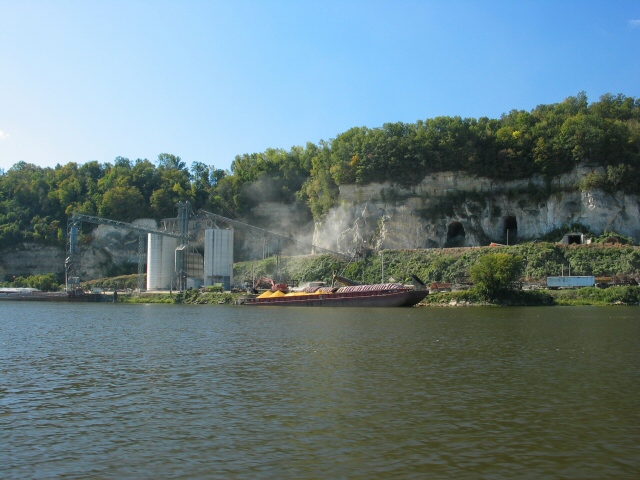 Corn barge being loaded from elevator, note dust