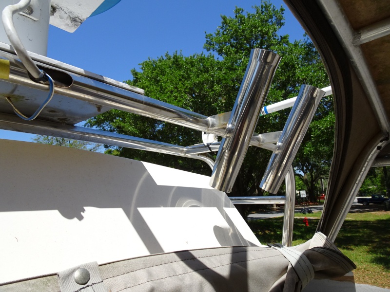 custom rod holders on radar arch, and zip open front of Bimini, to give good air flow in hot weather.