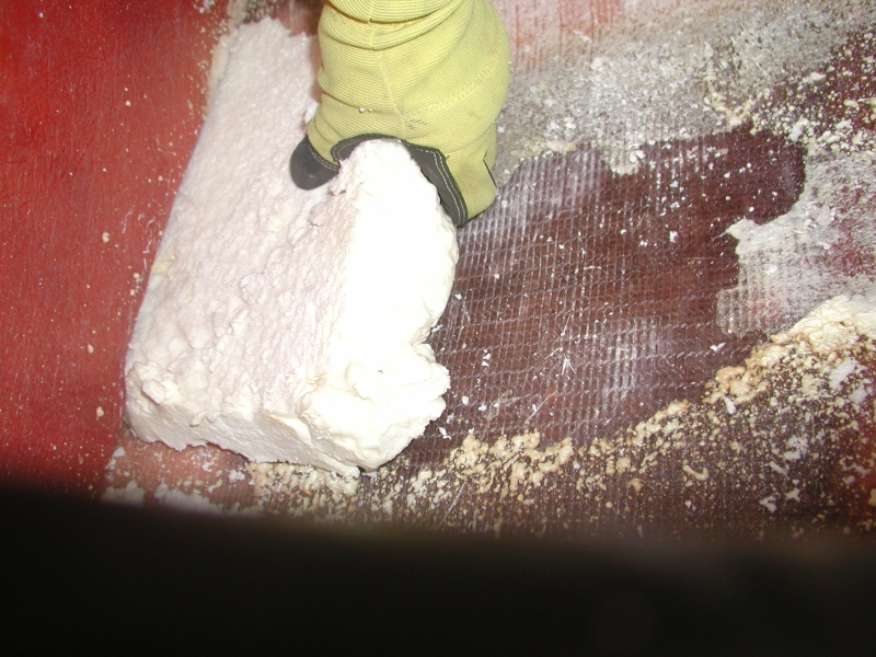 Cut it out with a hand saw then sanded with an orbital palm sander
