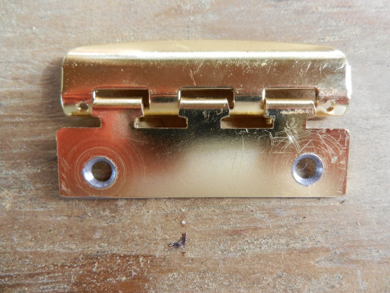 Cut mounting tab drilled with new countersunk holes