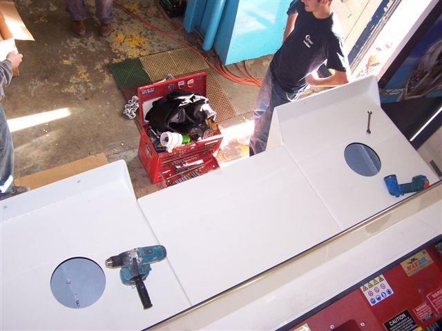 (Cygnet)No vertical rails, just hand holds in key spots.  Additional 16 sq ft of deck space.