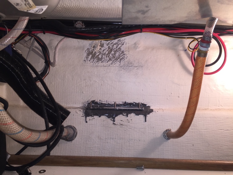 Deciding now to mount Heater higher up, where hull has been somewhat grinded, with old mounting bolts in sight, which will now become the support bracket bolts.