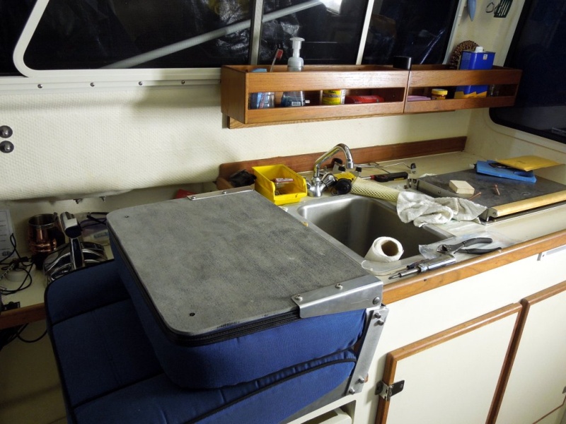 Did the same with this seat as was done on the 22, cut the hinges and attached  cutting board material to the back of the seat.  Don?t really like the look of the back cutting board material so will probable replace with white.