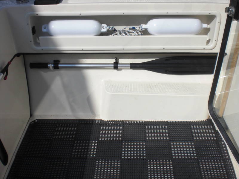 Dink oar stowage in cockpit.