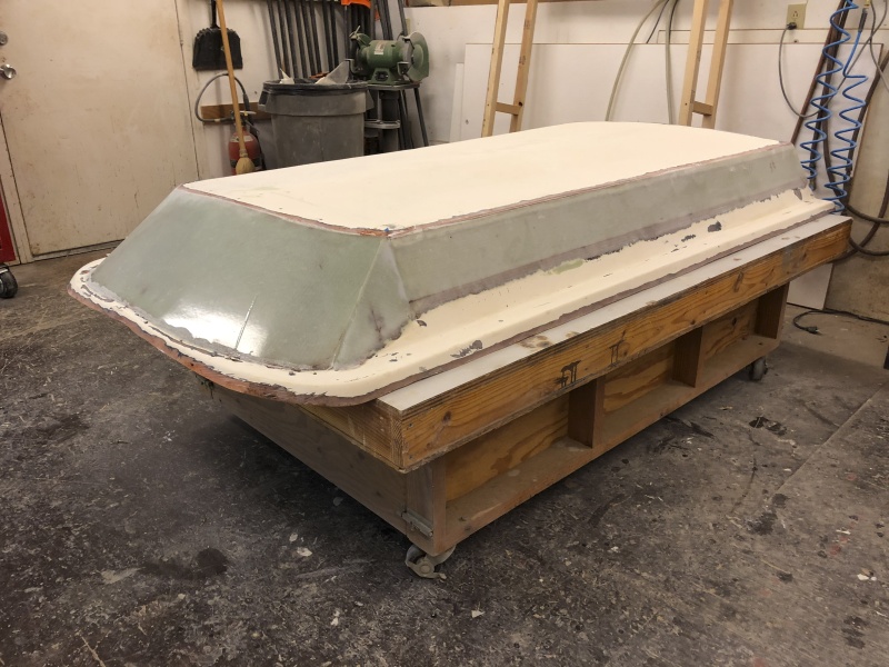 Done. Well, except for sanding and fairing. The new sections consist of two layers of 1708 with additional layers at the edges and corners. Note that while the roof section of this hightop is 4" higher like the factory high top, it is longer than the factory hightop, meaning the front angle is a steeper pitch. My reason for adding a hightop is to provide a place to store 30" x 64" thin flex solar panels, and the ceiling space in a standard factory high top is too short to allow this.