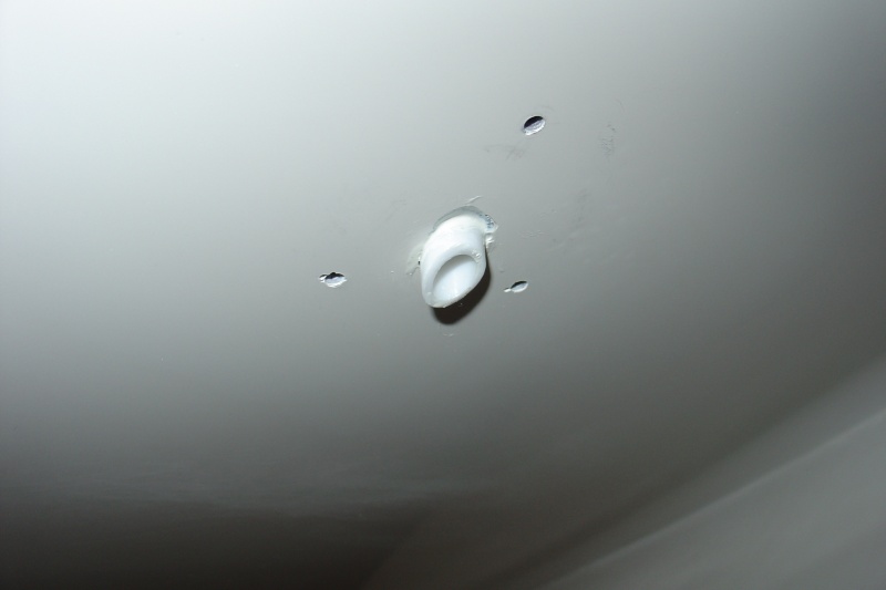 Drain tube cut at angle and a little longer so that dirty water from anchor locker does not stain hull.