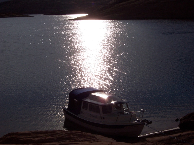 Early morning sun reflecting on water and S