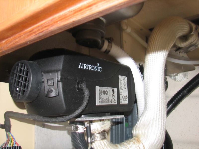 Espar Heater on forward wall of galley cabinet