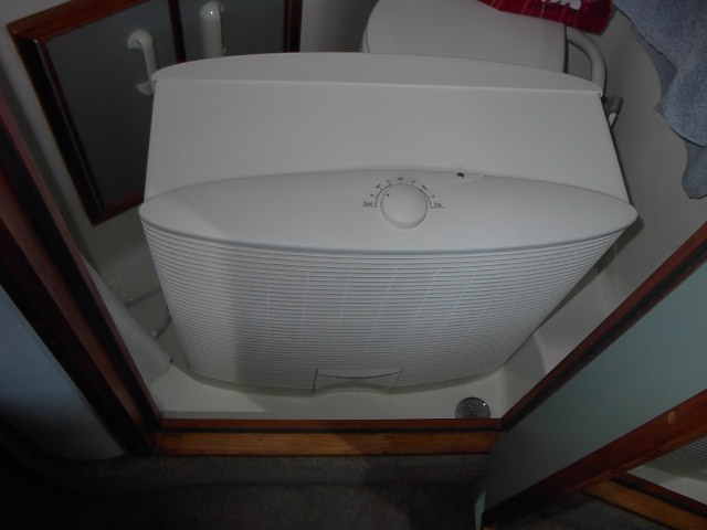 Evaporate cooler works well in dry climate of Northern California. Here it's setting on the floor of the bathroom, but fits under dinette, on galley floor, out in cockpit, etc.