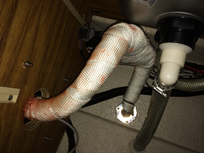 exhaust and muffler to thru hull. dry fit it 4-5 times put rv seal on it and one little corner folded maing it not fit the exhaust out on the heater result was one more cur and red seal all over white wrap...oh well