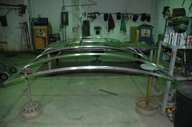 Fabricating frame rail for cockpit roof and cabin roof storage.