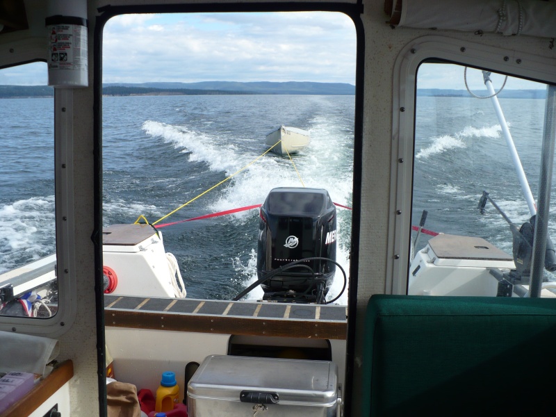 Fare West II towing the big canoe