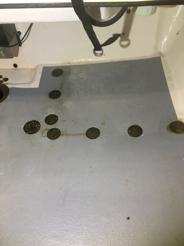 Filling all the holes with fiberglass resin.