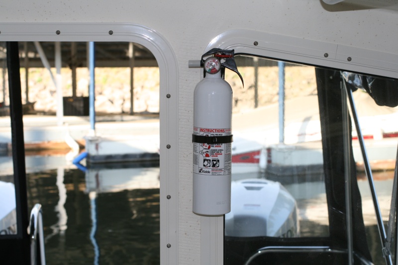 Fire extinguisher installed on port side of rear door - used the screw from the window frame.